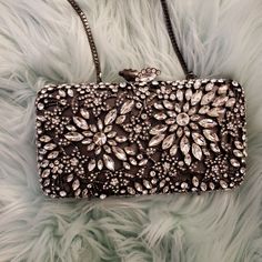 Glint Crystal Floral Clutch Size: 7"W X 3 ¾"H X 1 ½"D | Length: 20 1/2" Shoulder Strap Drop. | Wt: 1.3 Lbs. Nwot | Comes With Bonus Extra Crystals! Details & Care Ornate Floral Filigree Encrusted With Shimmering Crystals Makes This Petite Clutch An Elegant Evening Standout. *Magnetic Closure *Optional Drop-In Chain Strap *Lined *Glass/Acetate/Metal Silver Sparkling Evening Clutch, Elegant Silver Bag For Night Out, Silver Rectangular Gala Bag, Sparkling Silver Evening Bag For Night Out, Chic Silver Bags For Gala, Chic Silver Bag For Gala, Formal Silver Sparkling Clutch, Elegant Rectangular Bags With Silver Accents, Silver Embellished Clutch For Night Out