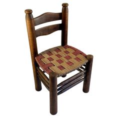 a wooden chair with a woven seat pad