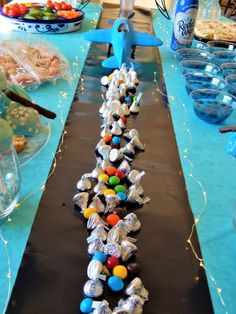 a long table topped with lots of candy