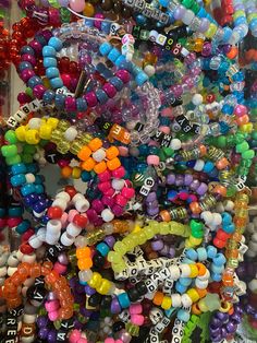 many different colored beads are stacked on top of each other