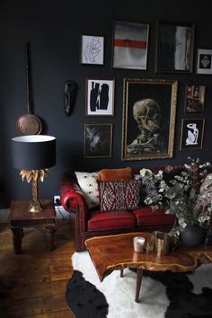 a living room filled with furniture and pictures on the wall