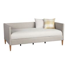 a white daybed with two pillows on it