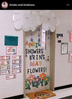 a classroom door decorated with flowers and clouds