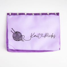 a purple bag with the word knit picks written on it and a ball of yarn