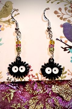 So Cute These are a mini version of the other Soot Sprite earrings that I sell in my shop! They are a dainty and adorable version.  Made with glass beads and enamel charms And 925 Sterling Silver wires Hypoallergenic Novelty Sterling Silver Earrings, Novelty Hypoallergenic Sterling Silver Earrings, Novelty Sterling Silver Hypoallergenic Earrings, Whimsical Black Jewelry For Gifts, Handmade Black Novelty Earrings, Unique Black Hypoallergenic Jewelry, Whimsical Black Earrings With Ear Wire, Whimsical Black Drop Earrings, Novelty Black Earrings For Gift