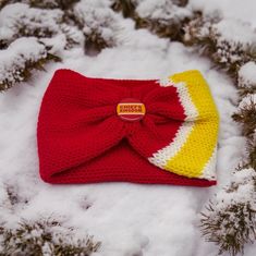 Handmade Kansas City Chiefs Knit Headband/Ear Warmer - Red, Yellow, and White Twist Knot with Chiefs Kingdom Button Celebrate your love for the Kansas City Chiefs with this vibrant, handmade knit headband/ear warmer! Featuring bold red, yellow, and white colors, this headband is accented with a stylish twist knot and a "Chiefs Kingdom" button, making it a perfect accessory for any fan. Features: *Color: Red, Yellow, and White *Material: Soft, high-quality yarn *Design: Twist knot with a Chiefs Kingdom button accent *Size: One size fits most Perfect For: *Keeping your ears warm while showing off your team spirit *Adding a bright and bold touch to your game-day outfit *Gifting to Chiefs fans and sports enthusiasts Care Instructions: *Hand wash in cold water *Lay flat to dry Show your Chiefs Crochet Kc Chiefs, Chiefs Crochet, Crochet Kc Chiefs Hats, Kansas City Chiefs Earrings, Chiefs Earrings, Kansas City Chiefs Jewelry, Cozy Headbands, Button Making, Chiefs Kingdom