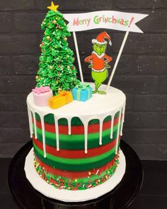 a christmas cake with the grinch on top