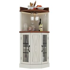 a corner cabinet with wine glasses and bottles on it's top, in front of a white background