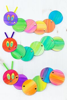 the very colorful caterpillar craft is made with colored paper