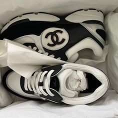 Authenticity Guaranteed New In Box Chanel 2022 Limited Edition Black / White / Silver Sneakers In Size 37.5 ( Us Size 7.5) Sold Out Online Luxury White Sneakers With Cushioned Footbed, Designer White Sneakers For Running, Luxury Low-top Sneakers For Running, Black Chanel Sneakers, Chanel Trainers, 2022 Sneakers, Chanel 2022, Shoe Story, Chanel #1