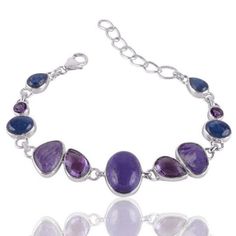 "Kyanite Charoite and Amethyst 925 Silver Choker Necklace * Bracelet in the picture is shown only to demonstrate a mix and match combination. Price quoted only for the necklace. Product Detail- Width2.50 cm Weight31 Gms Approx Size18' + 2\" Ext. Extra MetalSilver Stone Detail- AmethystMix Shapes (7 Pcs) KyaniteMix Shapes (6 Pcs) CharoiteFancy (5 Pcs) Braclets details: Product Detail- Width1.70 cm Weight17.25 Gms Approx Size7.50 to 8.50 Inch MetalSilver Stone Detail- AmethystMix Shapes (4 Pcs) Ky Purple Multi-stone Gemstones In Sterling Silver, Silver Amethyst Jewelry With Multi-stone, Amethyst Multi-stone Healing Jewelry, Fusion Style Amethyst Multi-stone Jewelry, Fusion Multi-stone Amethyst Jewelry, Fusion Style Multi-stone Amethyst Jewelry, Spiritual Sterling Silver Bracelet With Purple Gemstone, Purple Sterling Silver Jewelry With Stones, Purple Sterling Silver Fusion Jewelry