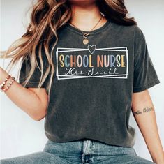 Custom School Nurse Shirt, School Nurse TShirt, School Nurse Gift, Back To School, School Nurse Tee, Back To School, Retro Nurse Shirt This classic unisex jersey short sleeve tee fits like a well-loved favorite. Soft cotton and quality print make users fall in love with it over and over again. These t-shirts have-ribbed knit collars to bolster shaping. The shoulders are tapered for a better fit over time. Dual side seams hold the garment's shape for longer.  .: Made with 100% Airlume combed and Gray School Top With Letter Print, Gray Letter Print Top For School, School Nurse Shirt, Nursing School Gifts, Nurse Tshirt, School Health, School Nurse, School School, Nurse Shirt