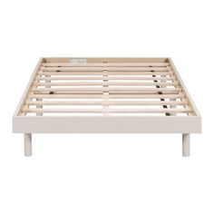 a white bed frame with wooden slats on the top and bottom legs, in front of a white background