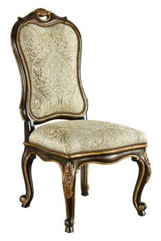 an ornate wooden chair with upholstered fabric