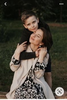 a woman holding a young boy in her arms while sitting on a bench with the caption that reads, i love you so much