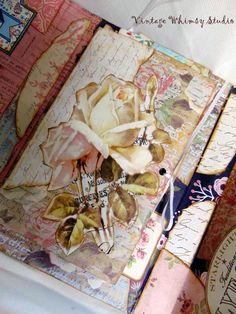 an altered book with flowers on it