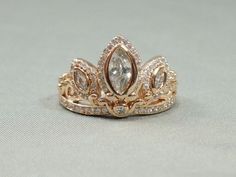 This Rapunzel tiara ring: | 29 Things To Help You Embrace Your Inner Disney Princess Tangled Crown, Tiara Rings, Rapunzel Tiara, Rose Gold Tiara, Disney Belle, Tiara Ring, Gold Tiara, Princess Ring, Crystal Rose