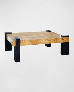 a wooden table with black metal legs