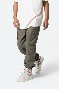 Vintage Cargo Pants - Camo | mnml | shop now Urban Cotton Cargo Pants For Outdoor, Combat Style Cotton Bottoms With Pockets, Cotton Cargo Combat Bottoms, Cotton Combat Cargo Bottoms, Combat Cotton Pants With Cargo Pockets, Military Style Cotton Cargo Pants For Streetwear, Urban Cotton Cargo Pants For Outdoor Activities, Combat Cotton Bottoms With Multiple Pockets, Urban Style Cotton Cargo Pants For Outdoor