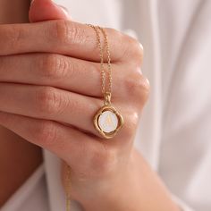 O V A L - I N I T I A L - N E C K L A C E Adorn yourself with timeless elegance using our Initial Pendant Necklace. Crafted with exquisite detail, this White Enamel & Gold Charm Necklace features an oval letter pendant, adding a personalized touch to any outfit. Perfect for gifting, it's a thoughtful gesture for birthdays, Mother's Day, or simply to show appreciation. Embrace minimalist sophistication with this vintage-inspired piece, designed to be cherished for years to come. *Material: 925 St White Round Initial Necklace For Anniversary, Elegant Birth Flower Locket Necklace, Elegant White Locket Necklace For Anniversary, Dainty Oval Link Charm Necklace For Gift, Dainty Oval Link Necklace For Gift, Gold Locket Necklace For Birthday, Elegant Initial Pendant Locket Necklace For Personalized Gift, Personalized Gold Locket Necklace For Birthday, White Oval Pendant Locket Necklace As Gift