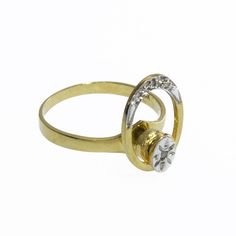 a gold and diamond ring on a white background