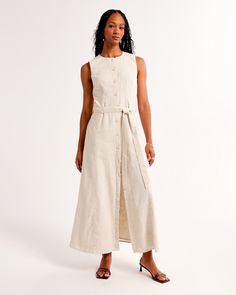 Flattering midi dress in our soft linen-blend fabric and relaxed-fit silhouette, featuring a self-tie removable belted waist and functional button-through detail. Spring Belted Dress With Tie Fastening For Daywear, Linen Tie Waist Dress For Daywear, Spring Midi-length Belted Dress With Tie Fastening, Chic Linen Maxi Dress With Relaxed Fit, Chic Relaxed Fit Linen Maxi Dress, Spring Beige Belted Dress With Tie Waist, Fitted Belted Linen Dress For Daywear, Linen Midi Dress With Tie Waist, Linen Midi Dress With Tie Waist For Daywear