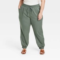 These High-Rise Modern Ankle Jogger Pants from A New Day™ are a versatile and timeless addition to your casualwear wardrobe. Made from lightweight fabric, these high-rise jogger pants are perfect for all-day comfort. The drawstring waistband ensures a secure fit, while the slim leg and regular fit provide a flattering silhouette. Designed with a drawstring waistband for a secure and customizable fit, they feature side and back pockets for functional flair. Showcasing a solid hue for easy coordin Solid Tapered Leg Sweatpants For Spring, Solid Color Spring Sweatpants With Tapered Leg, Versatile Spring High-waisted Sweatpants, Spring Versatile High-waisted Sweatpants, Spring Solid Color Tapered Leg Sweatpants, Spring Sweatpants With Elastic Waistband And Cuffed Ankles, Spring Workwear Sweatpants, Ankle-length, Spring Loungewear Cargo Pants Ankle-length, Spring Joggers With Elastic Waistband And Cuffed Ankles