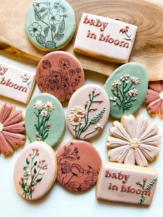 baby in bloom decorated cookies on a plate