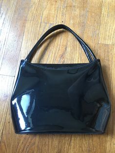 1960's black vinyl purse. Vinyl has some scratches 12 by 9 by 3 inches Black Retro Rectangular Evening Bag, Retro Black Rectangular Evening Bag, Vintage Black Shoulder Bag For Shopping, Retro Black Evening Bag, Black Retro Evening Satchel, Black Retro Satchel For Shopping, Vinyl Purse, Blue Belt, Top Handle Bags