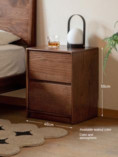 an image of a night stand next to a bed