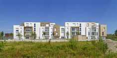 an apartment building with multiple balconies and windows