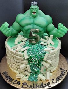 the hulk cake is made to look like it's celebrating his 5th birthday with green frosting and sprinkles