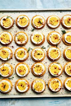 small appetizers are arranged on a baking sheet