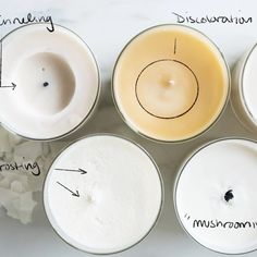 four different types of candles sitting on top of each other