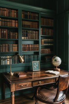 an old desk with a globe on it in front of bookshelves full of books