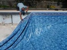 a man on a skateboard doing a trick in the air over a swimming pool