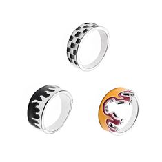 three rings with different designs on them