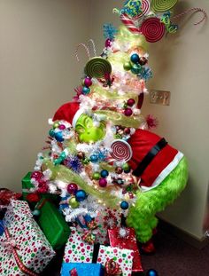 a christmas tree decorated with candy canes, lollipops and other holiday decorations