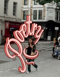 a woman walking across a street holding a cell phone