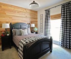 a bed room with a neatly made bed and wooden walls