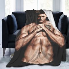 a man with his shirt open on a couch