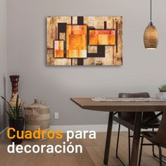 a dining room table with chairs and a painting on the wall above it that reads cuadros para decorar