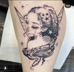 a tattoo on the leg of a woman