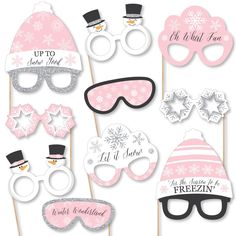 pink and silver winter photo booth props with snowman hats, sunglasses and mittens