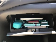 the interior of a car with various items in it