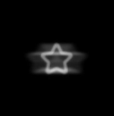 a blurry image of a star on a black background with white light coming from it