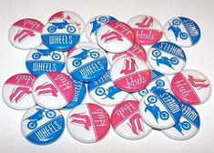 a pile of buttons with different designs on them, all in red and blue colors