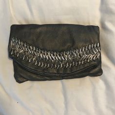 Gunmetal Vegan Leather Fold Over Clutch With Silver Detailing. Had Silver Shorts Holder Strap Of Long Crossbody Strap. Never Used Fold Over Clutch, Silver Shorts, Big Buddha, Fold Over, Crossbody Strap, Vegan Leather, Bag Lady, Leather, Silver