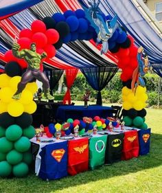 an outdoor party with balloons and decorations