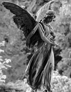 black and white photograph of an angel statue